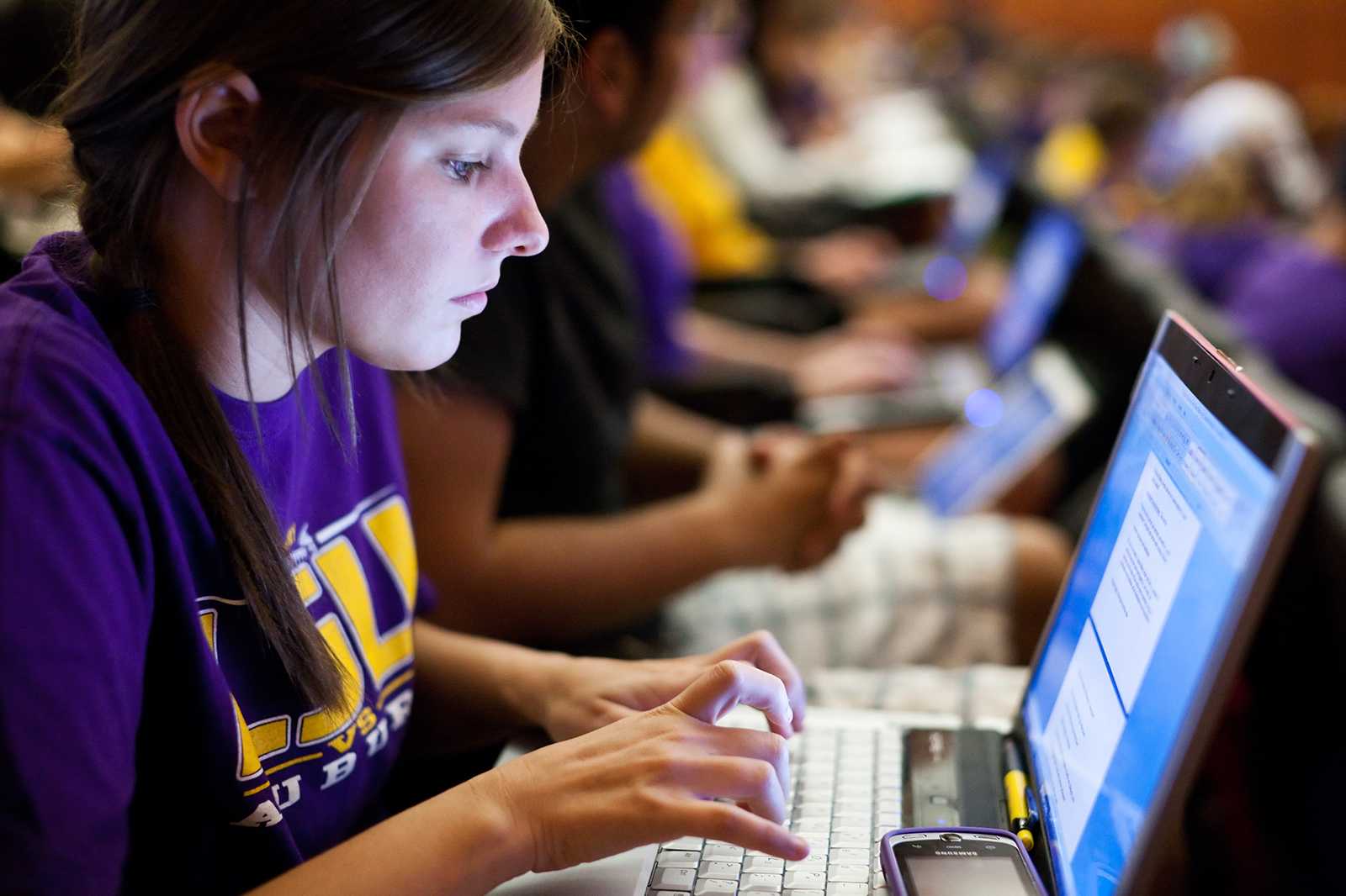 LSU Student at computer